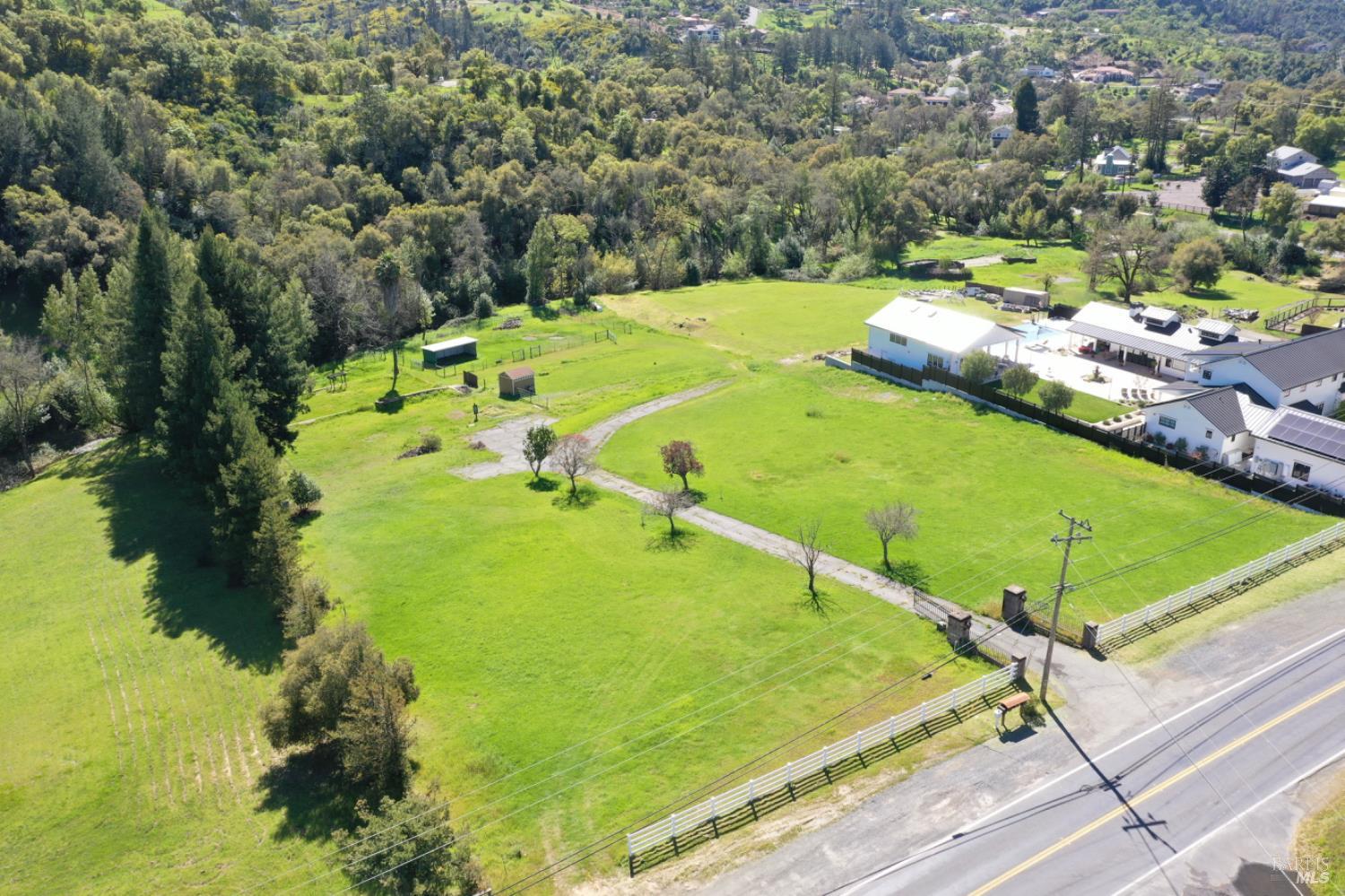 1360 Riebli Road Santa Rosa, CA 95404 - Photo 40 of 55 a view of a swimming pool with a yard