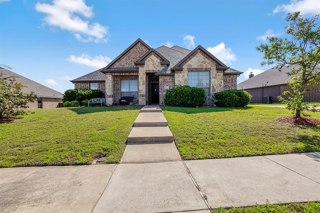3206 Meadow Ridge Drive Midlothian, TX 76065 - Photo 1 of 37 a front view of a house with yard