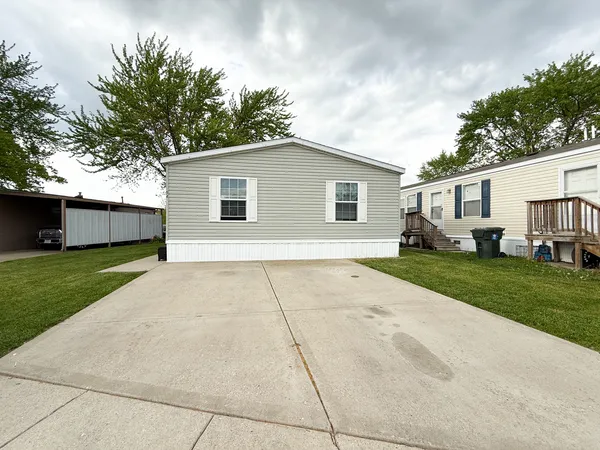a view of a yard in front view of a house