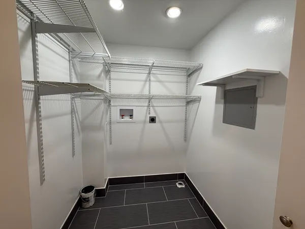 a bathroom with a shower and a mirror