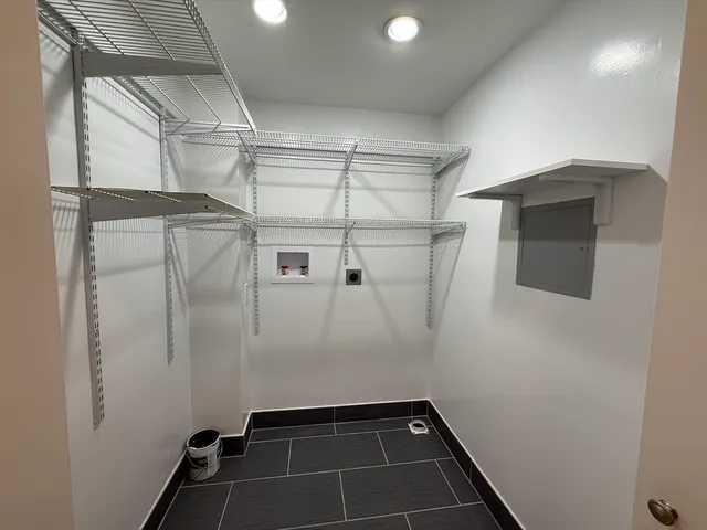 a bathroom with a shower and a mirror