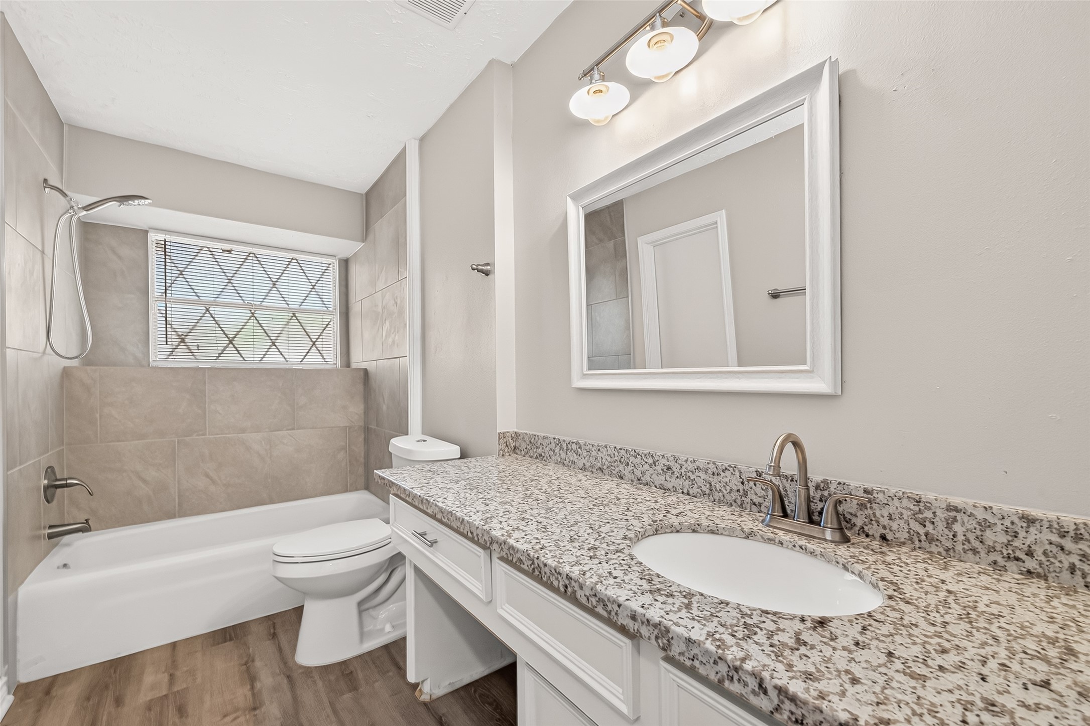 23235 Earlmist Drive Spring, TX 77373 - Photo 17 of 26 Hall bath has granite counters and tub/tile surround