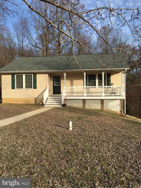 3355 Bayside Road Huntingtown, MD 20639 - Photo 1 of 15 front view of a house with a yard