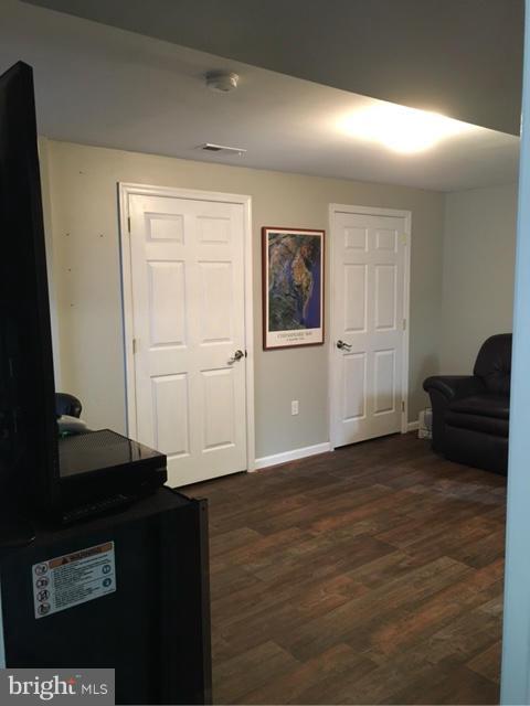 3355 Bayside Road Huntingtown, MD 20639 - Photo 14 of 15 a view of a livingroom with wooden floor and closet