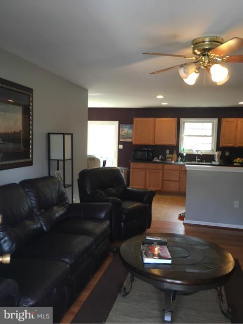 3355 Bayside Road Huntingtown, MD 20639 - Photo 3 of 15 a living room with furniture and a wooden floor