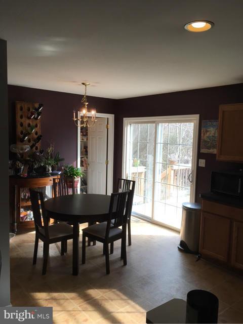 3355 Bayside Road Huntingtown, MD 20639 - Photo 5 of 15 a view of a dining room with furniture window and outside view