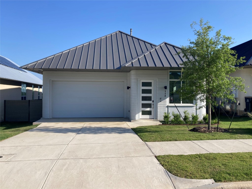 a front view of a house with yard
