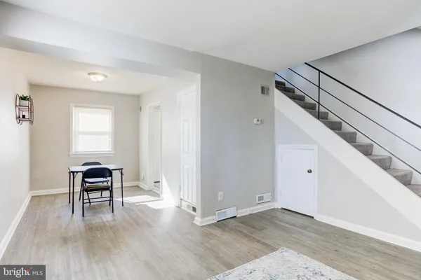 a view of a livingroom with furniture and wooden floor