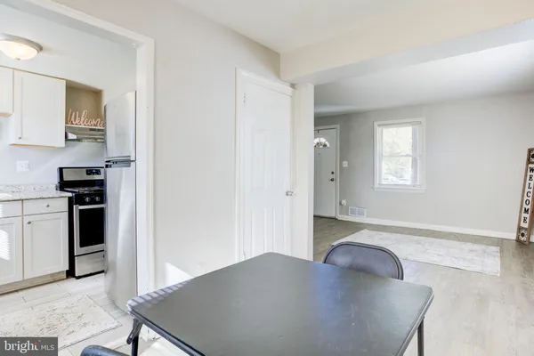 a kitchen with a refrigerator and a sink
