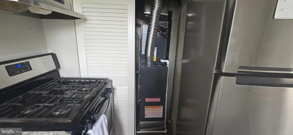 a kitchen with a stove and a refrigerator