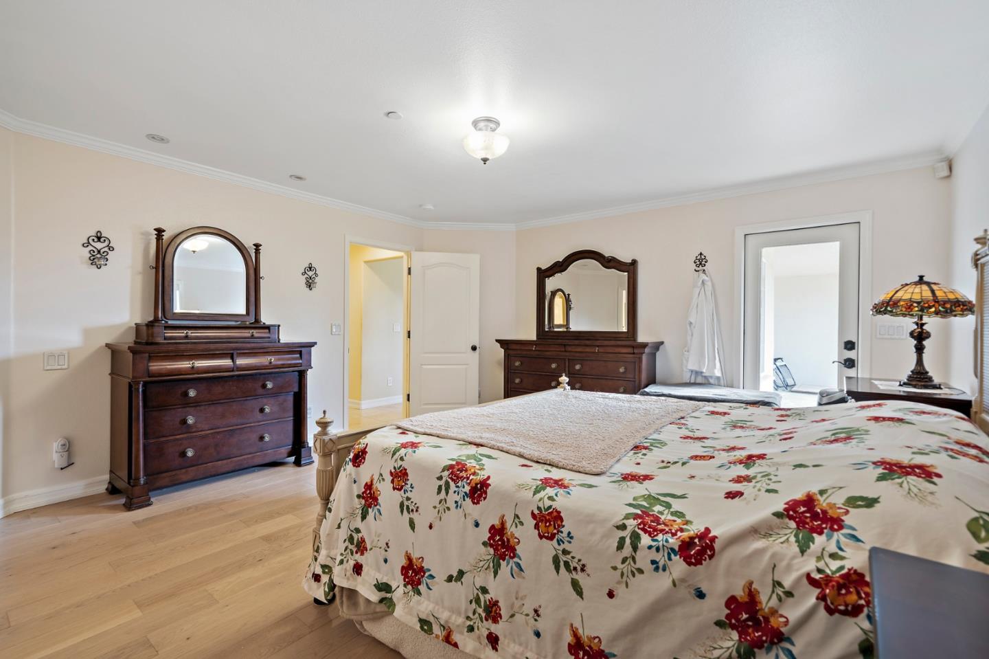 7388 Crews Road Gilroy, CA 95020 - Photo 17 of 32 a bedroom with a bed and a dresser in it
