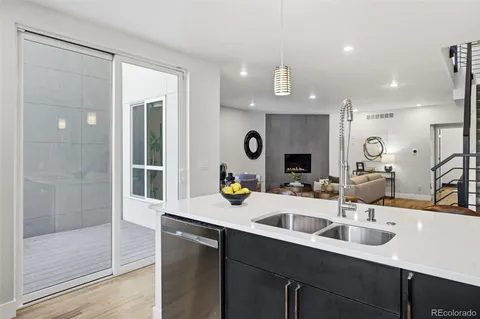 a kitchen with a sink and a refrigerator