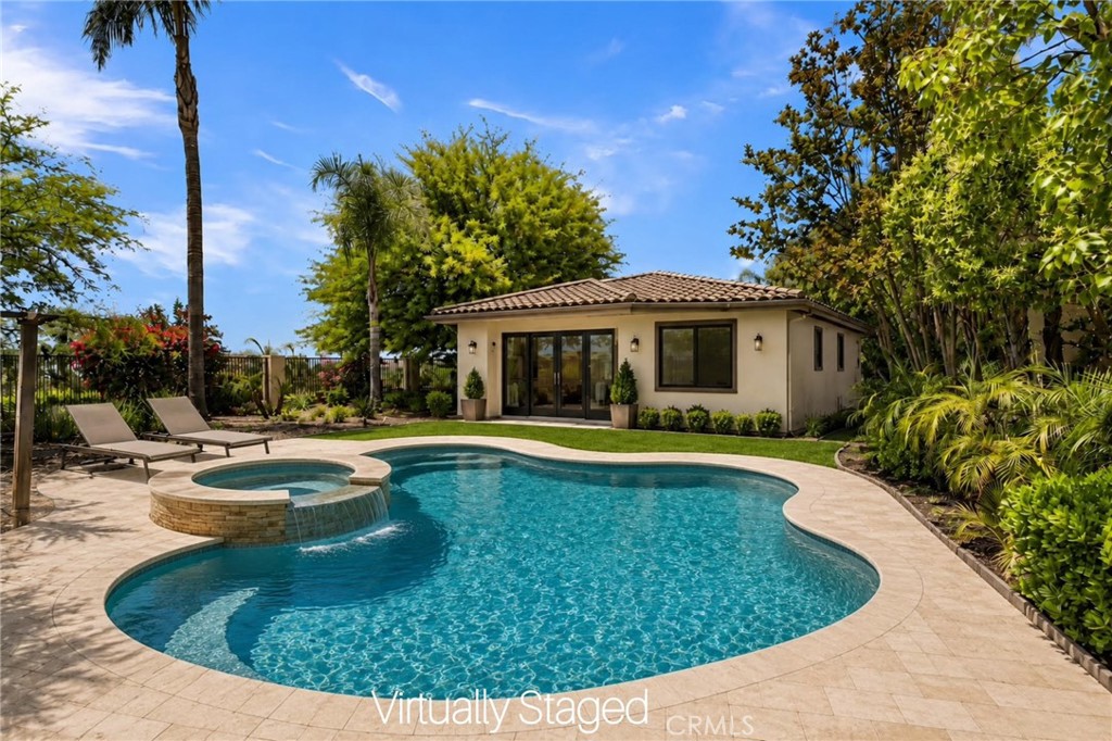 7780 Solitude Court Riverside, CA 92506 - Photo 57 of 71 a view of a house with swimming pool and a yard