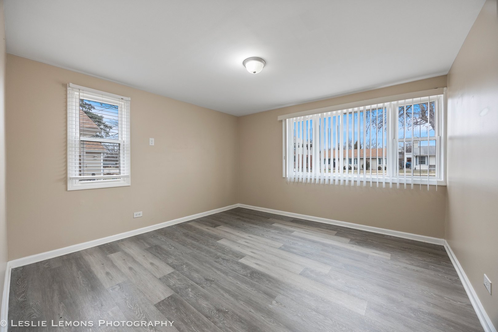 4949 Paxton Road Oak Lawn, IL 60453 - Photo 14 of 29 a view of an empty room with wooden floor and a window