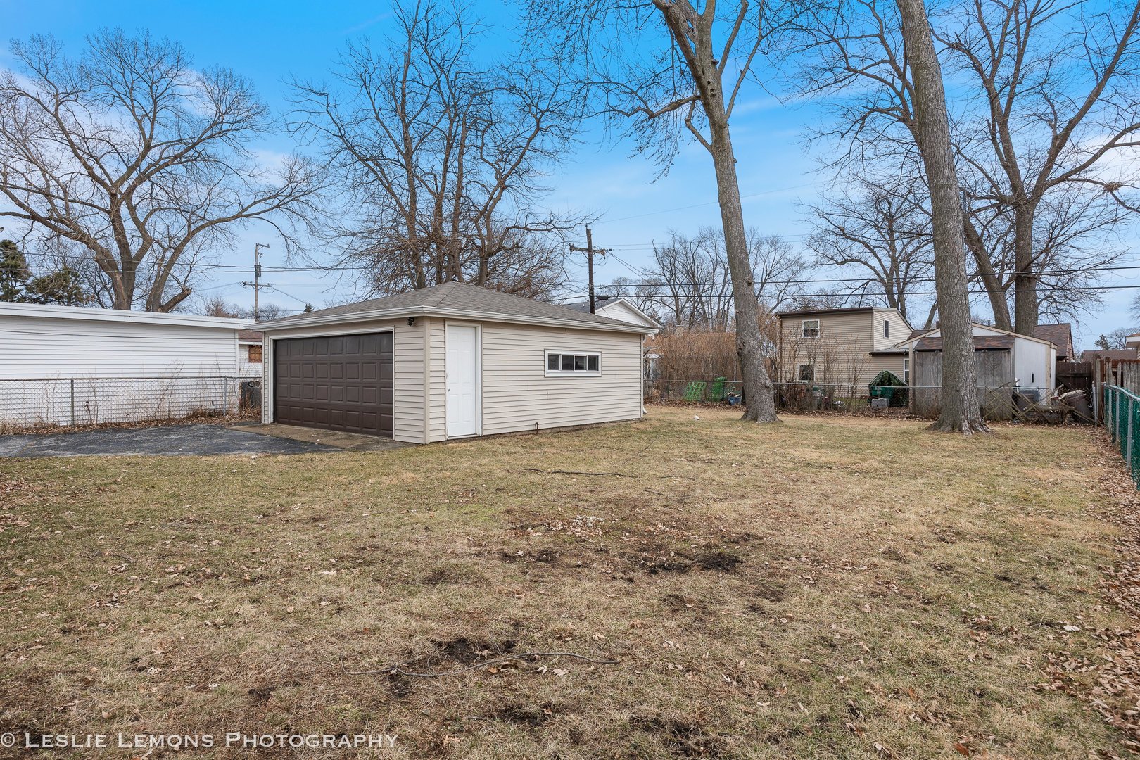 4949 Paxton Road Oak Lawn, IL 60453 - Photo 22 of 29 a view of a large white house with a large tree