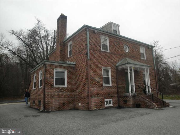 9702 Harford Road Baltimore, MD 21234 - Photo 2 of 17 a view of a house with a yard