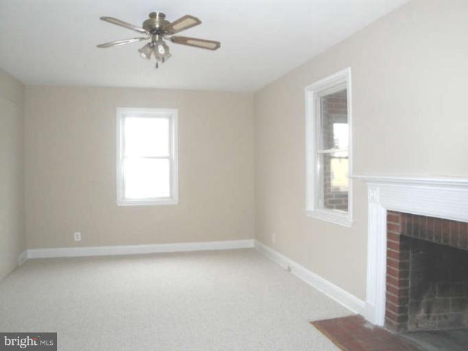 9702 Harford Road Baltimore, MD 21234 - Photo 14 of 17 a view of room with a ceiling fan and window
