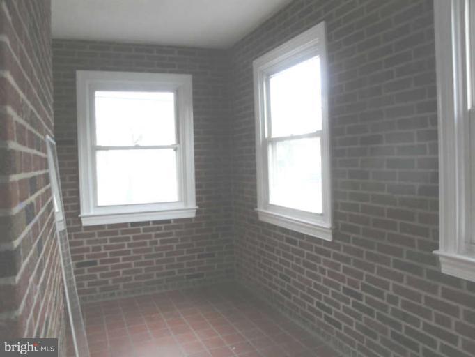 9702 Harford Road Baltimore, MD 21234 - Photo 16 of 17 a bathroom with a window