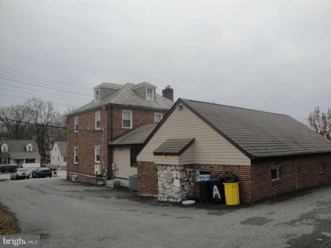 9702 Harford Road Baltimore, MD 21234 - Photo 4 of 17 a view of a house with flat outdoor space