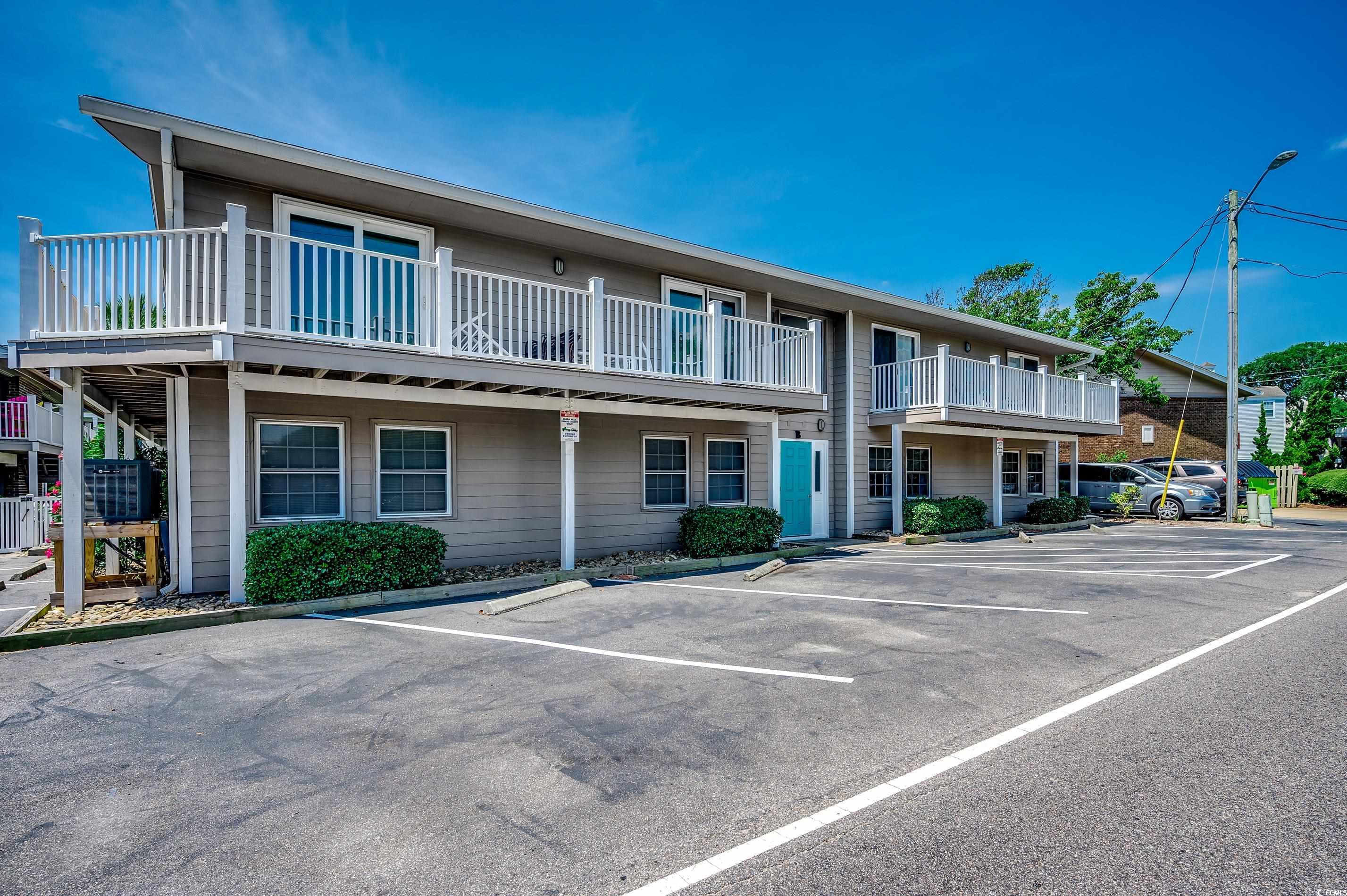 416 North Ocean Boulevard, Unit B7 Surfside Beach, SC 29575 - Photo 2 of 30 View of property featuring uncovered parking
