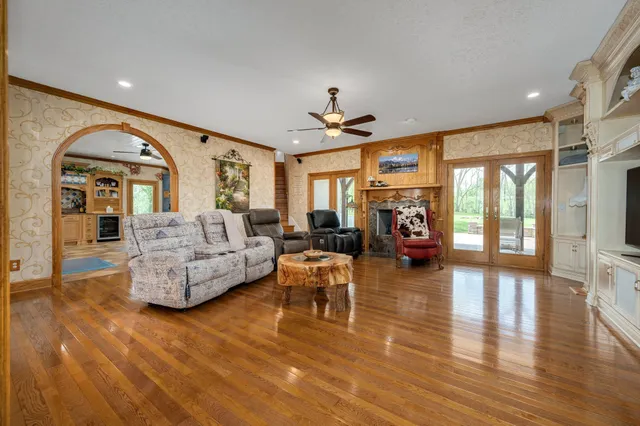 a spacious bathroom with a double vanity sink a mirror and a shower