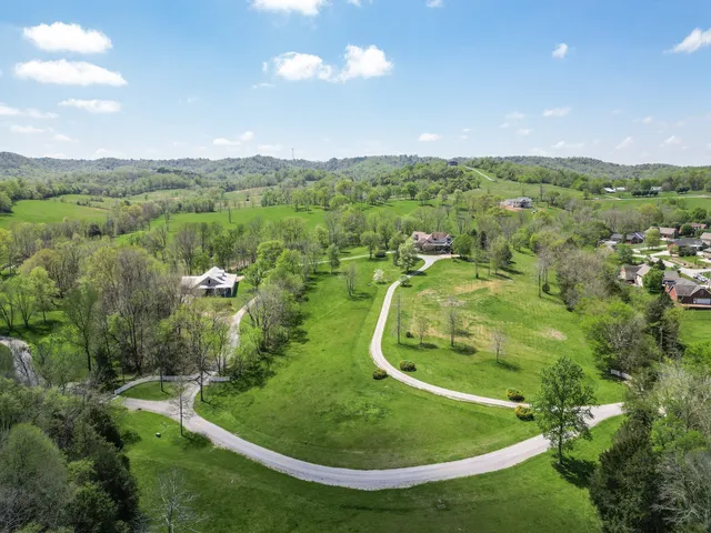 a view of a house with a yard porch and sitting area