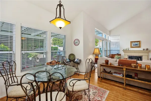 a dining room with furniture and window