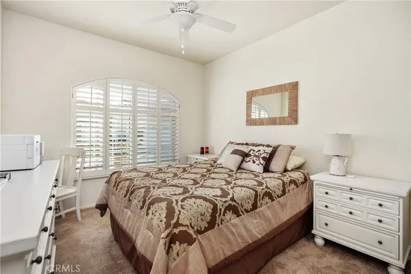 a bed room with a bed and a window