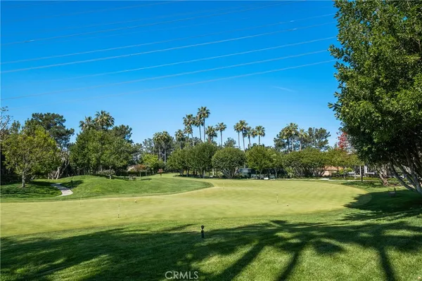 a view of a golf course with a lake
