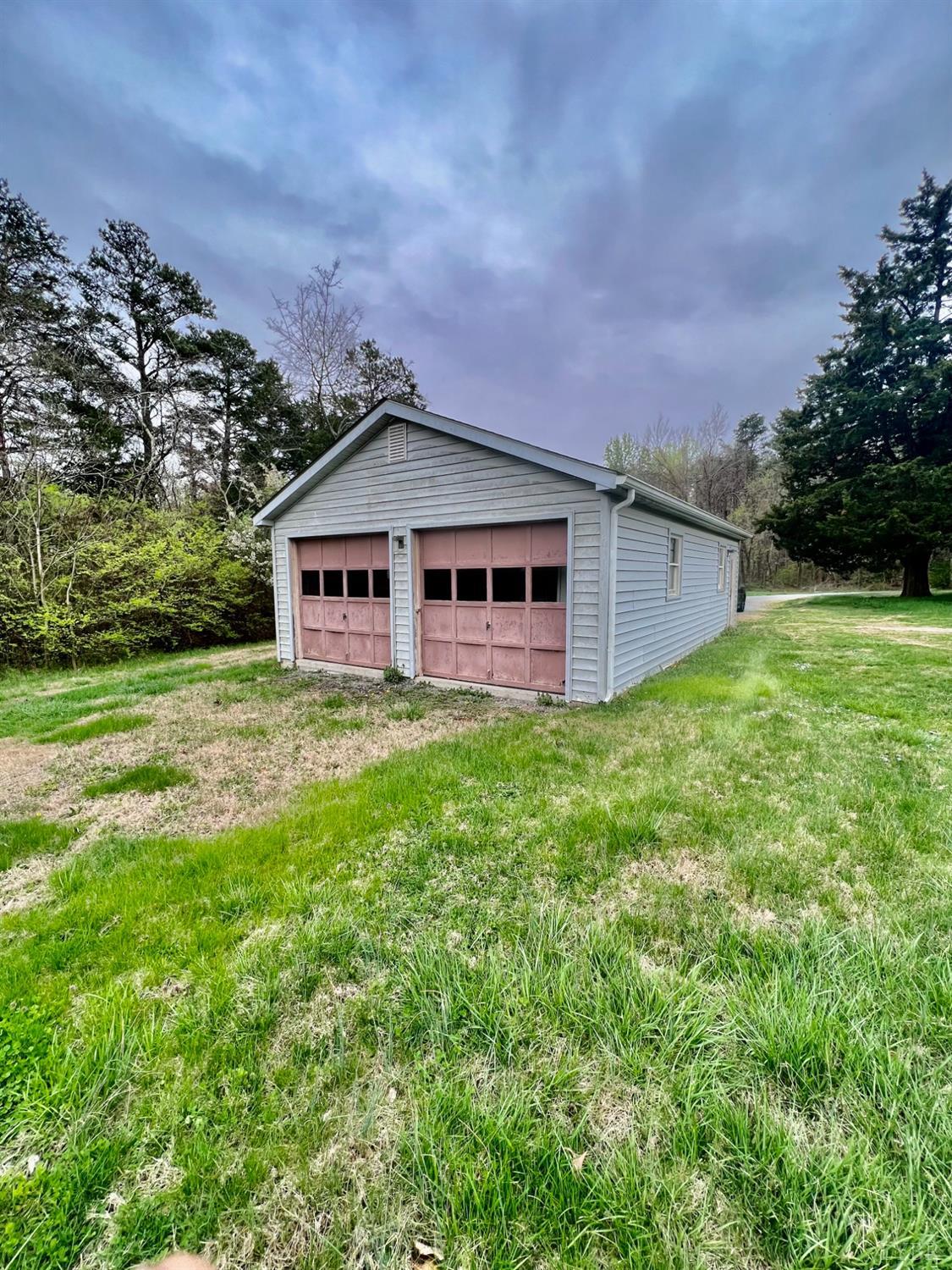 5507 Wards Road Evington, VA 24550 - Photo 3 of 15 a front view of a house with a garden and yard