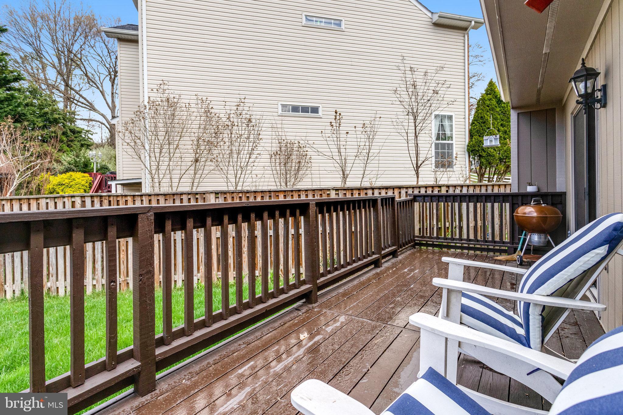 8708 Center Road Springfield, VA 22152 - Photo 3 of 46 a view of balcony with wooden floor and outdoor seating