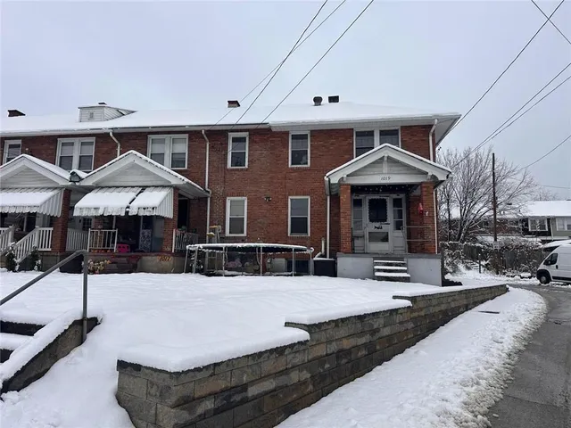a front view of a house with yard