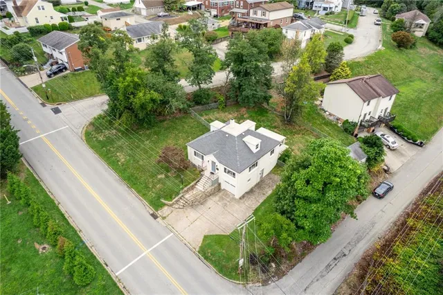 an aerial view of residential house with outdoor space