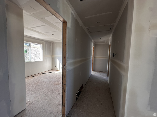 513 East Upper Cyn Road Smithfield, UT 84335 - Photo 16 of 25 Interior hallway featuring recessed ceiling lighting, a finished drywall room entryway, and a coffered ceiling in the adjacent room