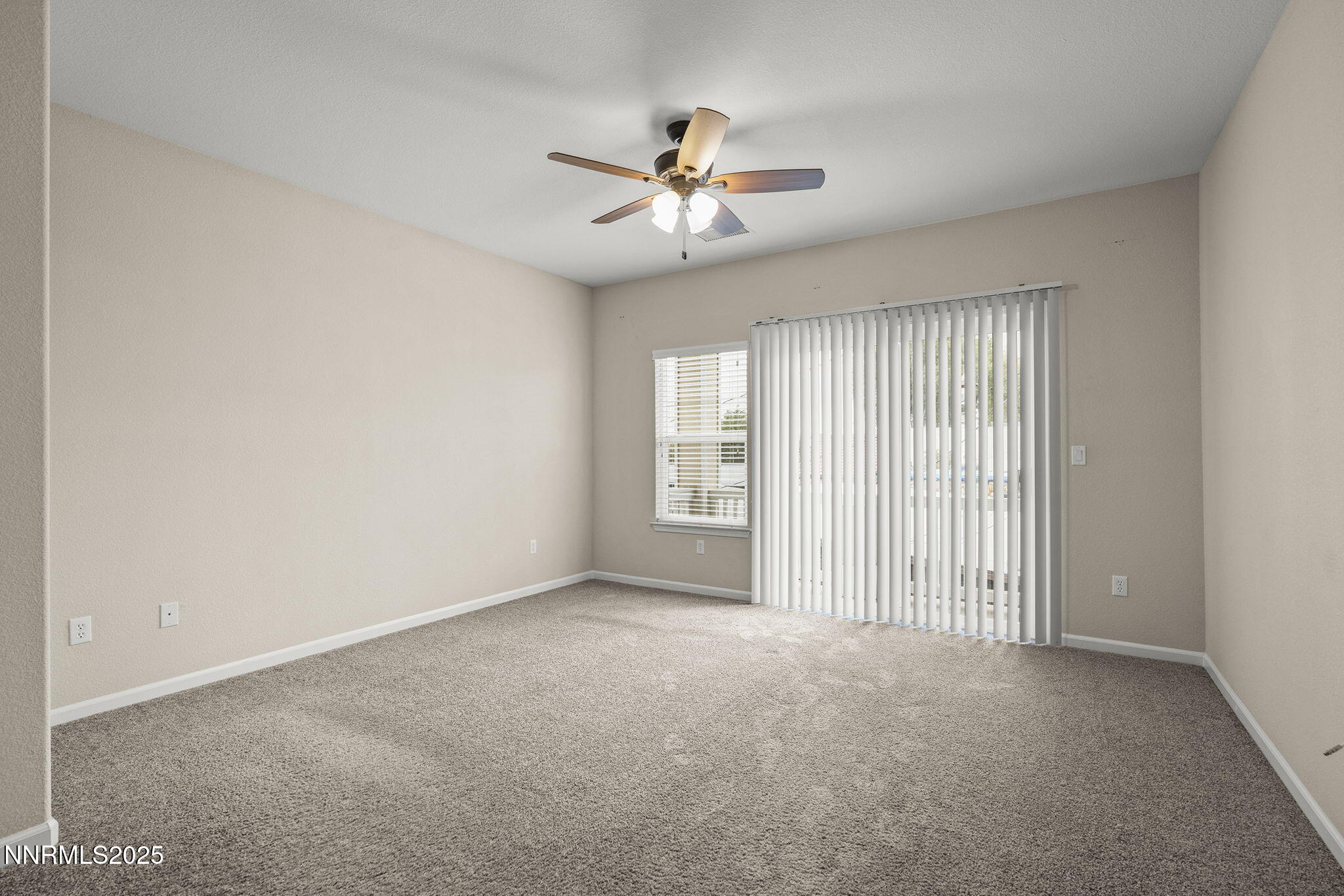 2040 Alamo Square Way Reno, NV 89509 - Photo 13 of 39 a view of a livingroom with a ceiling fan and window