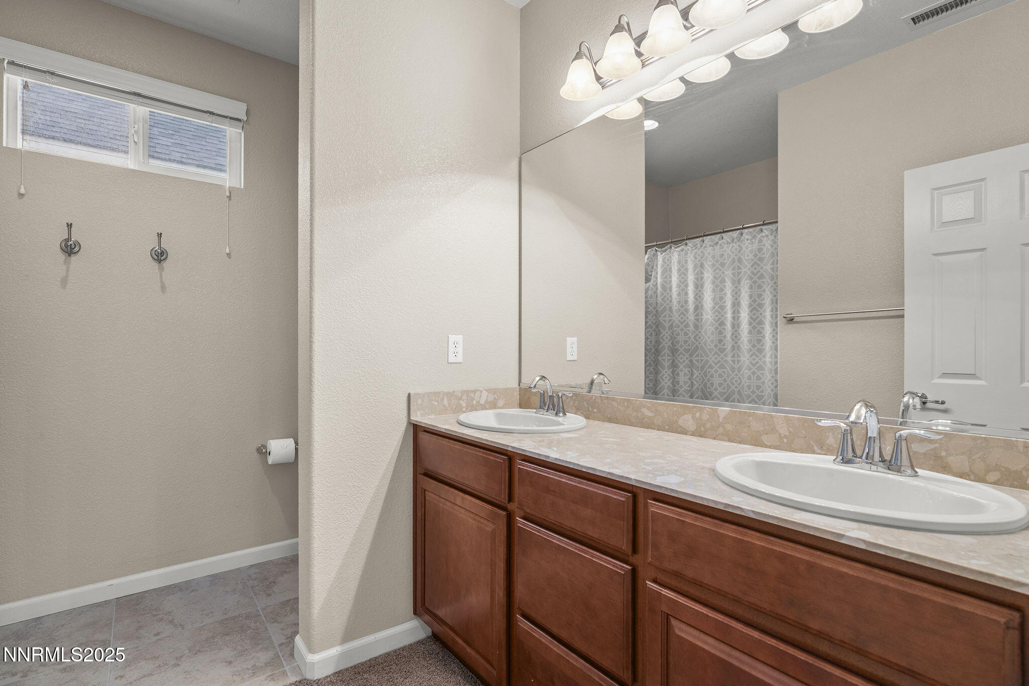 2040 Alamo Square Way Reno, NV 89509 - Photo 21 of 39 a bathroom with a sink and a mirror