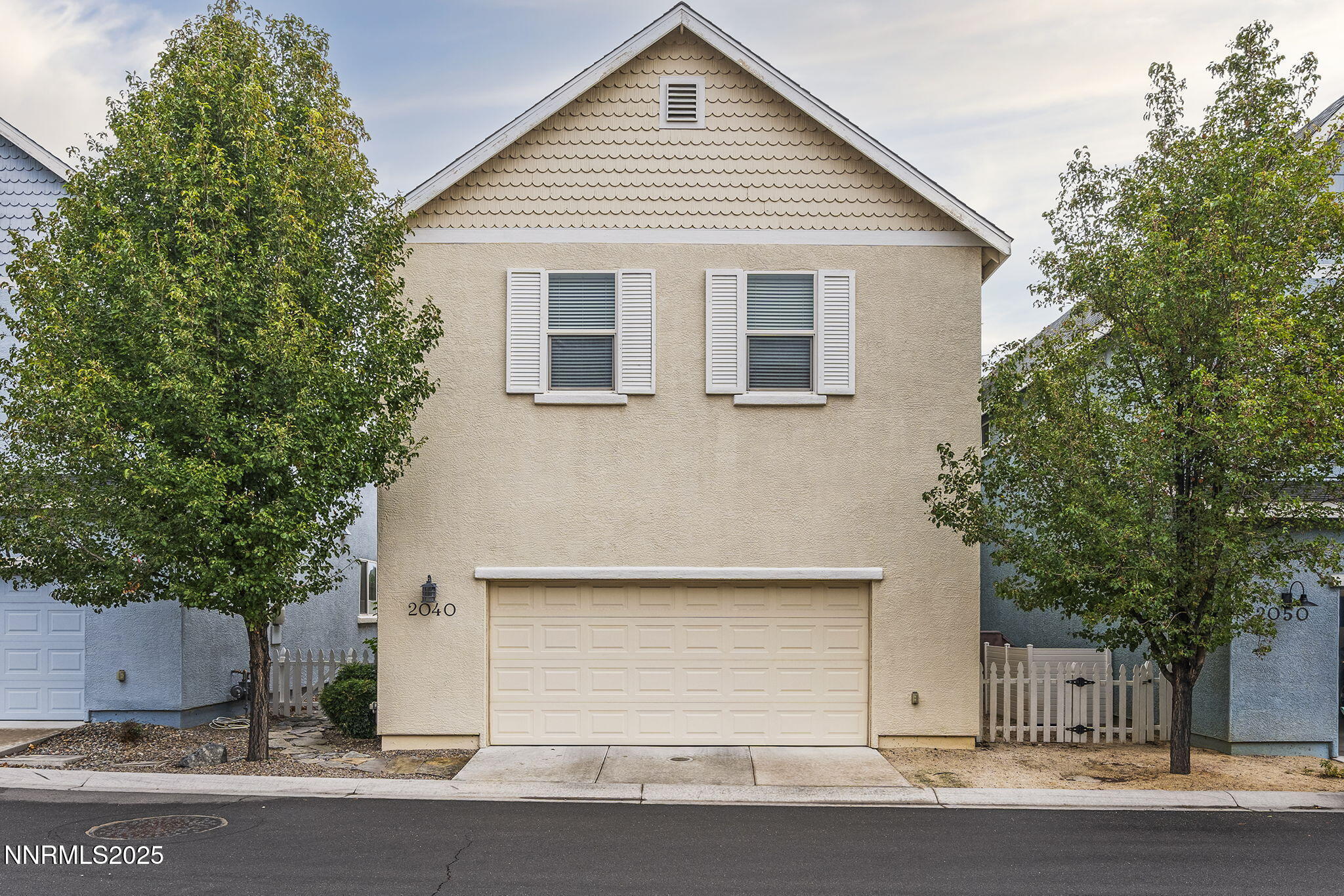 2040 Alamo Square Way Reno, NV 89509 - Photo 23 of 39 a front view of a house with a yard and garage