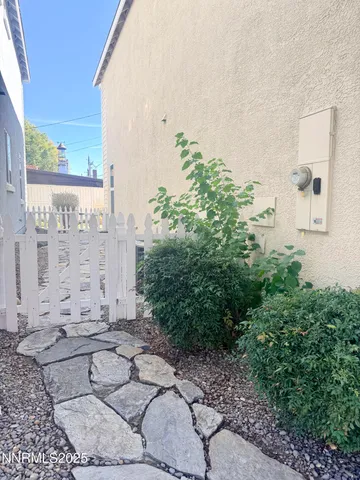 a view of a potted plants in back of a house