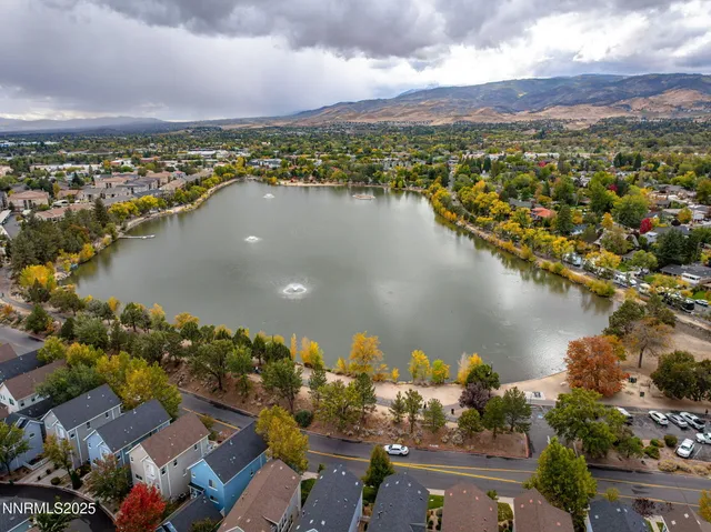 an aerial view of a city with lake view