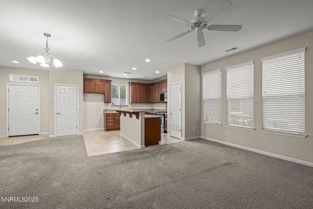a view of a kitchen with a sink and a window