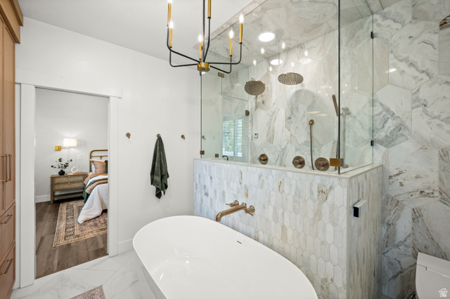 4077 Rons Court Riverton, UT 84096 - Photo 20 of 48 A spa-like retreat awaits, offering comfort, relaxation, and a touch of everyday luxury.