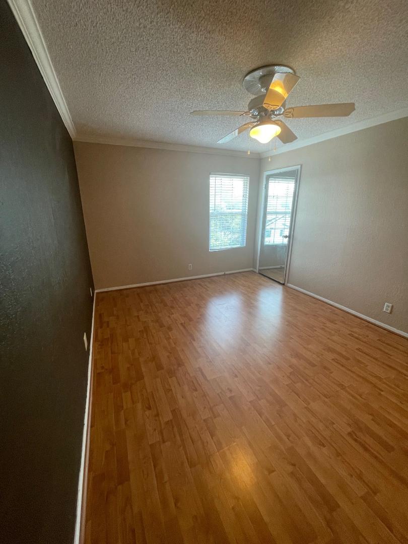 910 Duncan Lane, Unit 44 Austin, TX 78705 - Photo 7 of 15 Hardwood flooring and natural light elevate this inviting living space.