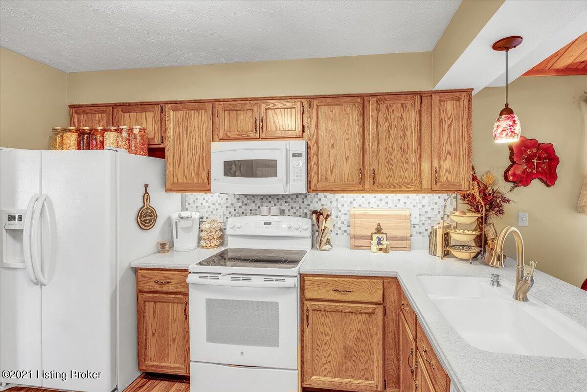 4304 Seagrape Road Louisville, KY 40299 - Photo 6 of 33 Featuring GE appliances, including a GE Profile Advantium Microwave