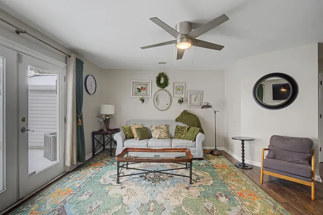 a living room with furniture and a window