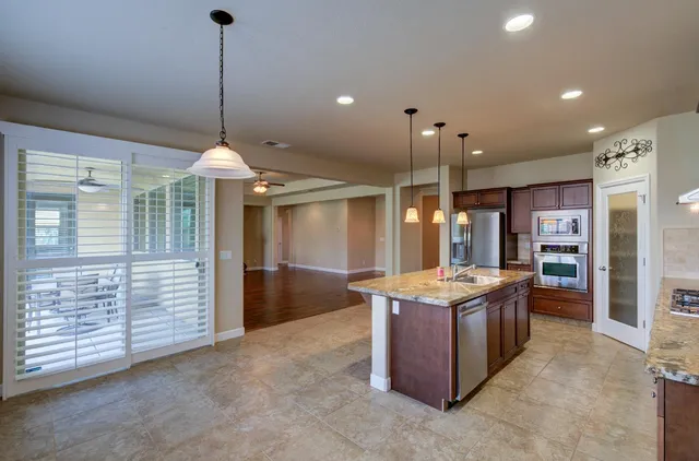 a kitchen that has a lot of cabinets in it