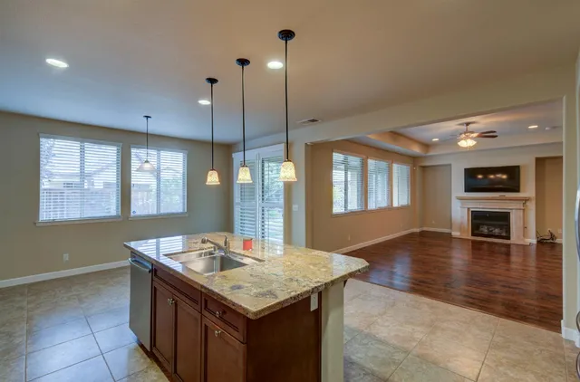 a kitchen with a stove and a kitchen island