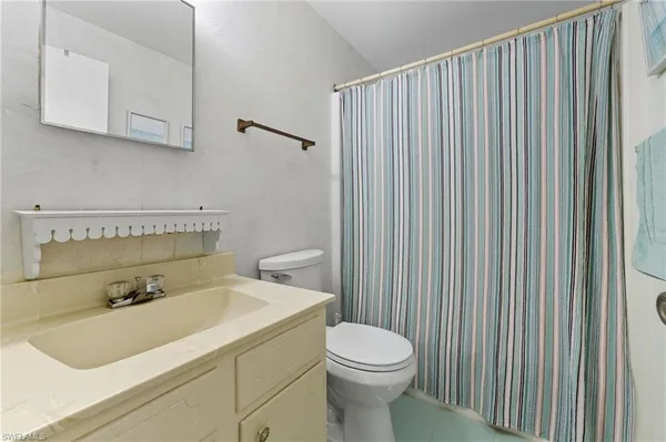 a bathroom with a sink and a toilet