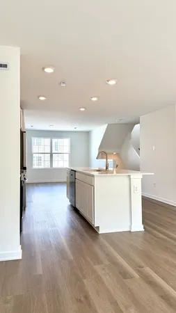 a view of a kitchen with a sink and a window