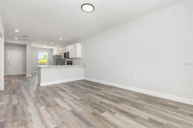 a view of a kitchen with a sink and a stove top oven