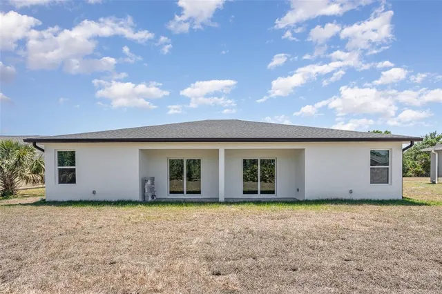 a view of house with yard